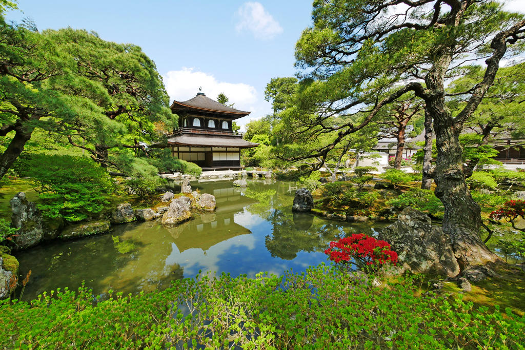 Ginkakuji Temple  or the "Silver Pavilion," reflects beautifully in the Pond surrounded by its garden in Kyoto, Japan. 