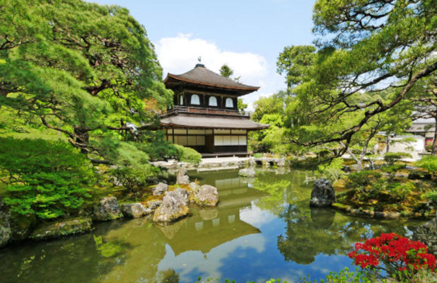 Ginkakuji Temple  or the "Silver Pavilion," reflects beautifully in the Pond surrounded by its garden in Kyoto, Japan. 